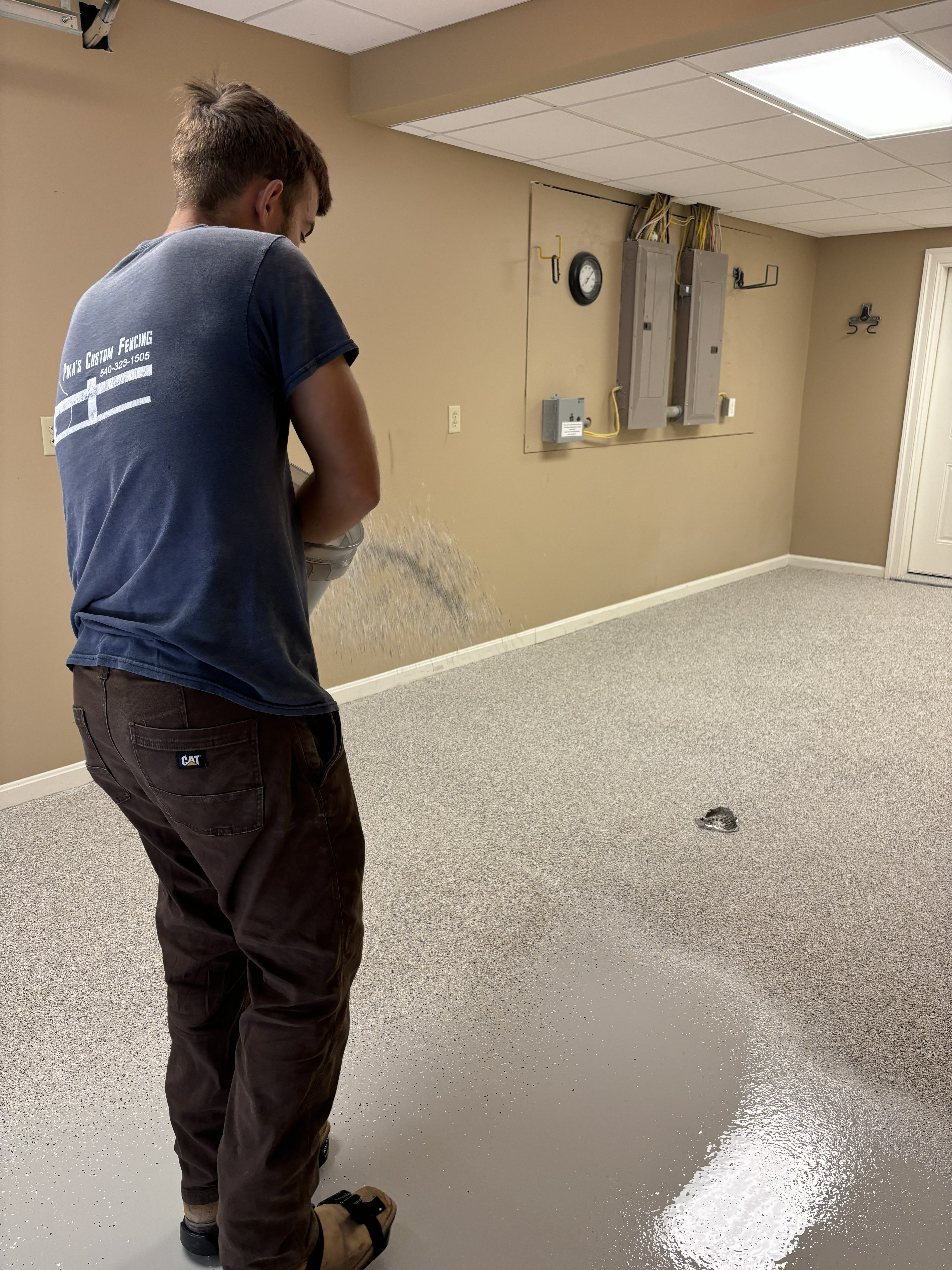Grand View Epoxy technician applying epoxy flooring